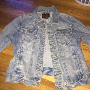 Light blue distressed denim jacket
